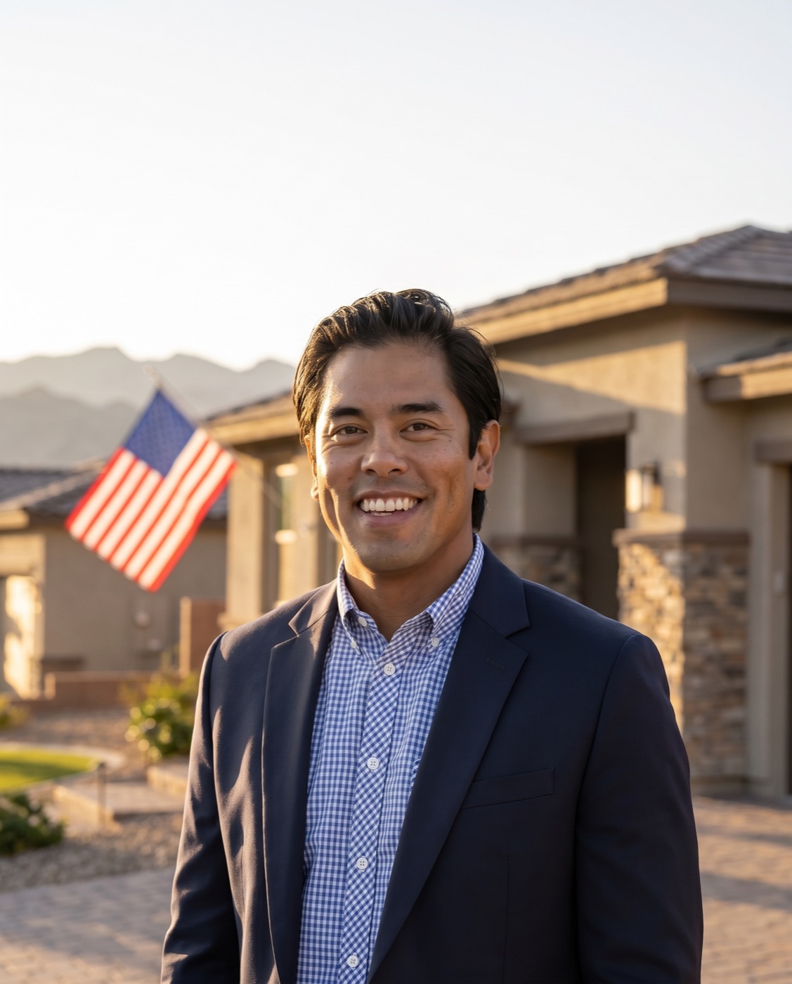 Jonathan Cosca, veteran-owned Las Vegas realtor and retired U.S. Air Force veteran, standing in front of a Las Vegas home with an American flag